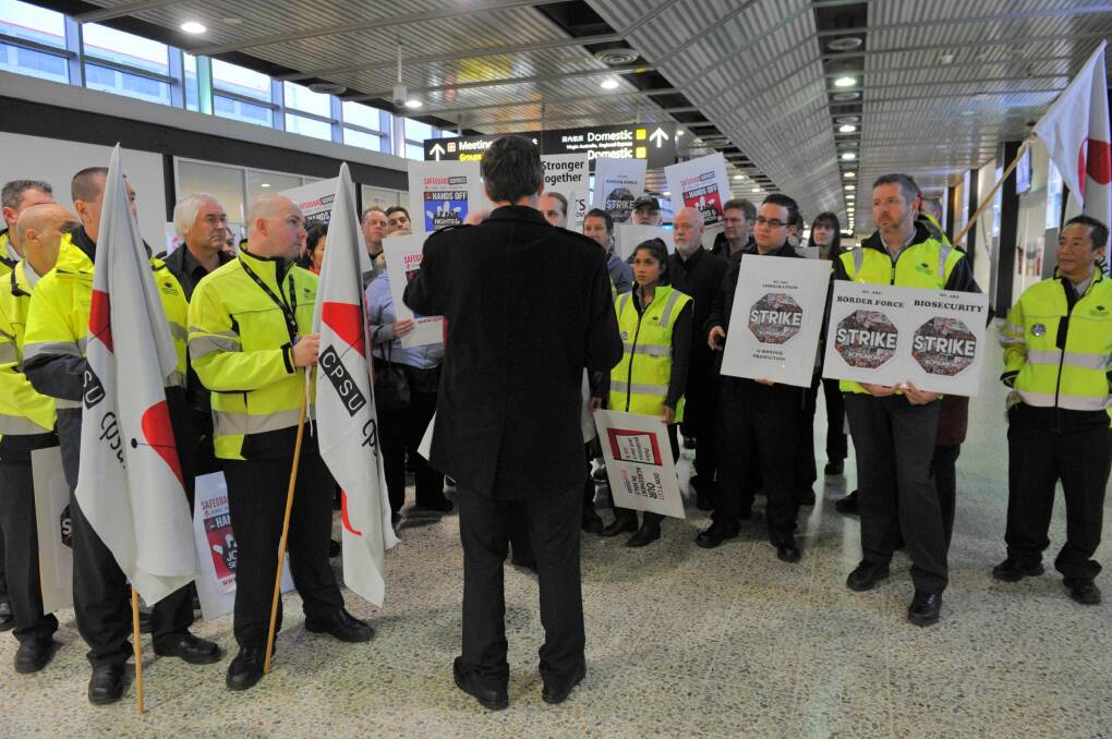 Airport workers have remained without a new employment agreement and pay rise for almost three years. Photo: Joe Armao