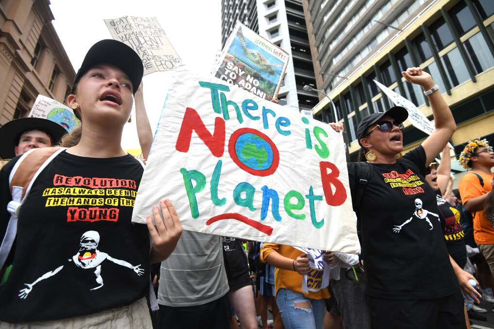 School students take part in the climate change strike in Brisbane. Photo: Dan Peled/AAP
