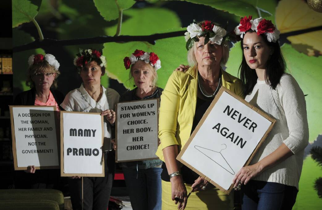 Canberra Polish women are against a new bill to ban abortion in Poland. Mother and daughter, Dana, left and Patricia Olejniczak at right foreground, with other Polish supporters from left, Mira Kwasik, Beata Wilder and Danuta Soczynski. Photo: Graham Tidy