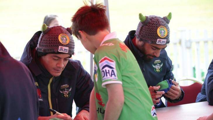Jeremy Hawkins and Reece Robinson at a Raiders fan session on Thursday. Robinson is likely to replace Hawkins, who was blocked from making his NRL debut on Sunday because of the second tier salary cap, in Canberra's team to take on the Gold Coast. Photo: Jeffrey Chan