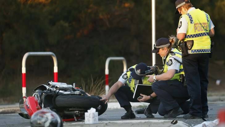 ACT Policing at the scene following a crash that left a motorcyclist in a critical condition at the intersection of Southern Cross Drive and Ratcliffe Cresent. Photo: Jeffrey Chan