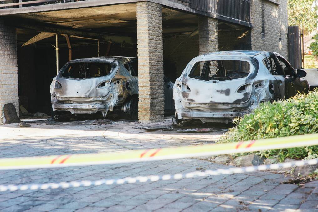 The aftermath on Sunday after a fire blazed through a home and several cars on Lambrigg St in Farrer Photo: Rohan Thomson