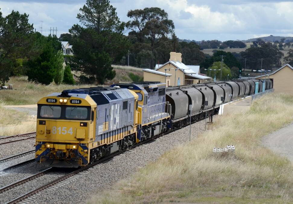 Port Kembla-bound Pacific National export wheat train passing through Gunning station.  Photo: Leon Oberg