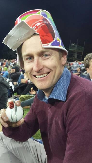 Tom Zouch with the ball he caught at the BBL half time show which broke his finger. Photo: Supplied
