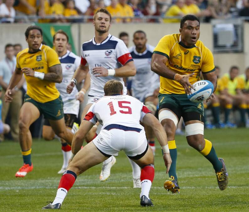 Ruled out: Wycliff Palu looks to pass the ball against United States at Soldier Field. Photo: Kamil Krzaczynski