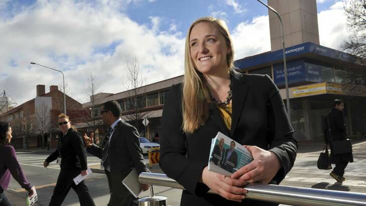 Candidate Julie Melrose hands out Greens pamphlets in Tuggeranong this week. Photo: Graham Yidy