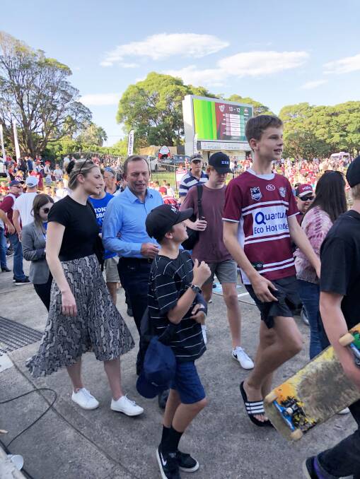 Tony Abbott arrives at Brookvale Oval with his daughter Bridget on Saturday for the NRL game between  Manly and South Sydney. Photo: Kevin Rawsthorne