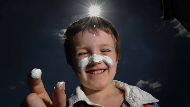 FACING FACTS: Joe O'Daly, 7, applies a thick smear of zinc cream which though unpleasant is the most effective block to damaging ultraviolet light. Photo: Colleen Petch
