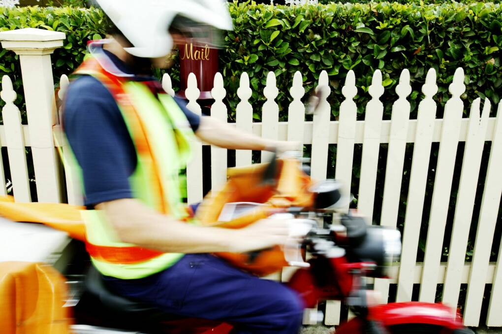 A postie has been awarded compensation of about half a million dollars after being hit by a car. Photo: Louie Douvis