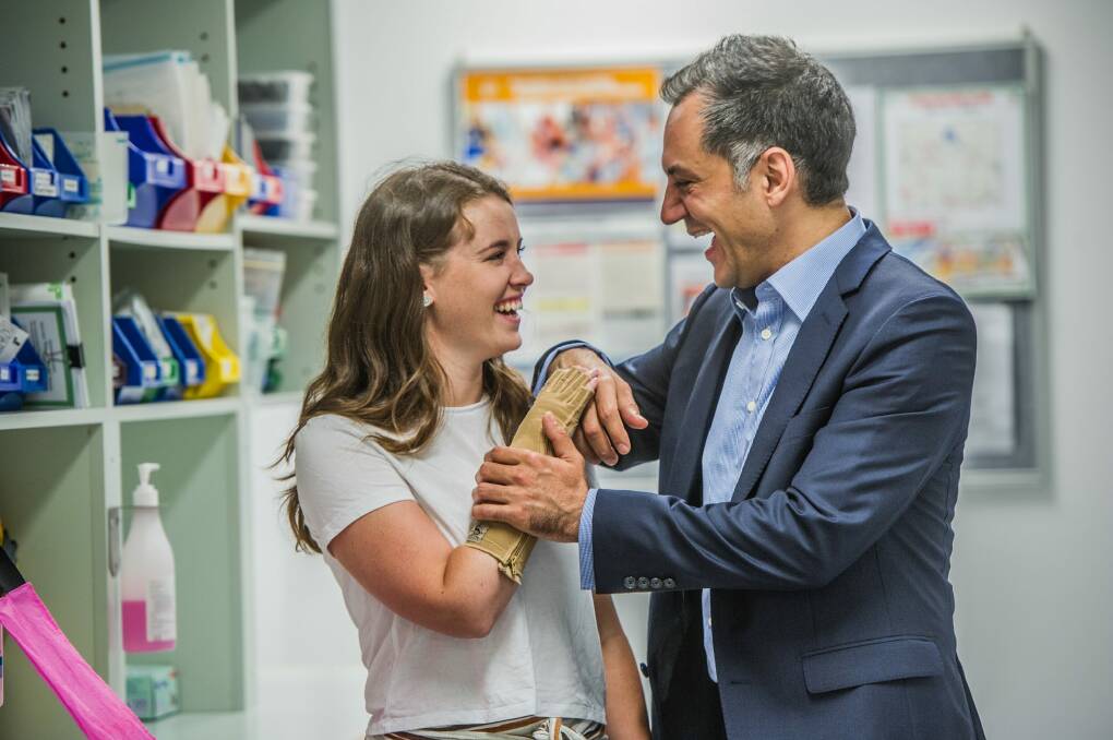 A bond for life: University of Canberra student Sarah Hazell had her right hand re-attached by Ross Farhadieh in what he believes was the procedure of his career. Photo: Karleen Minney