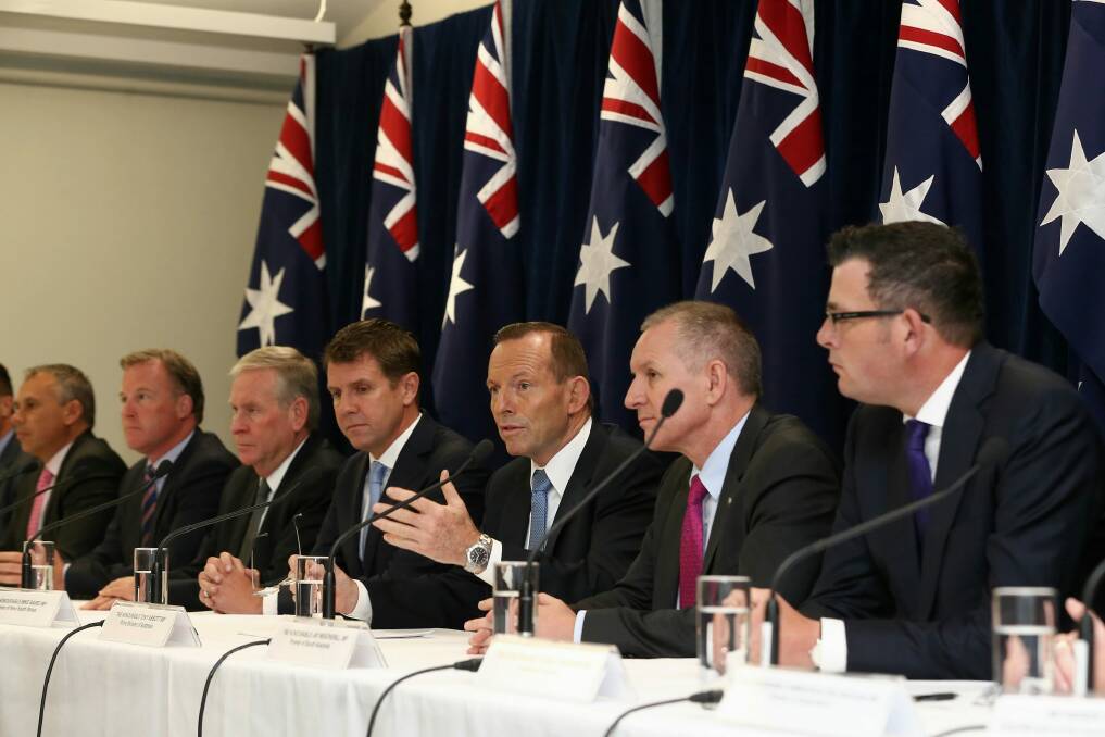 Forgotten agenda: Tony Abbott with state and territory first ministers at the leaders' retreat in July. Photo: Alex Ellinghausen
