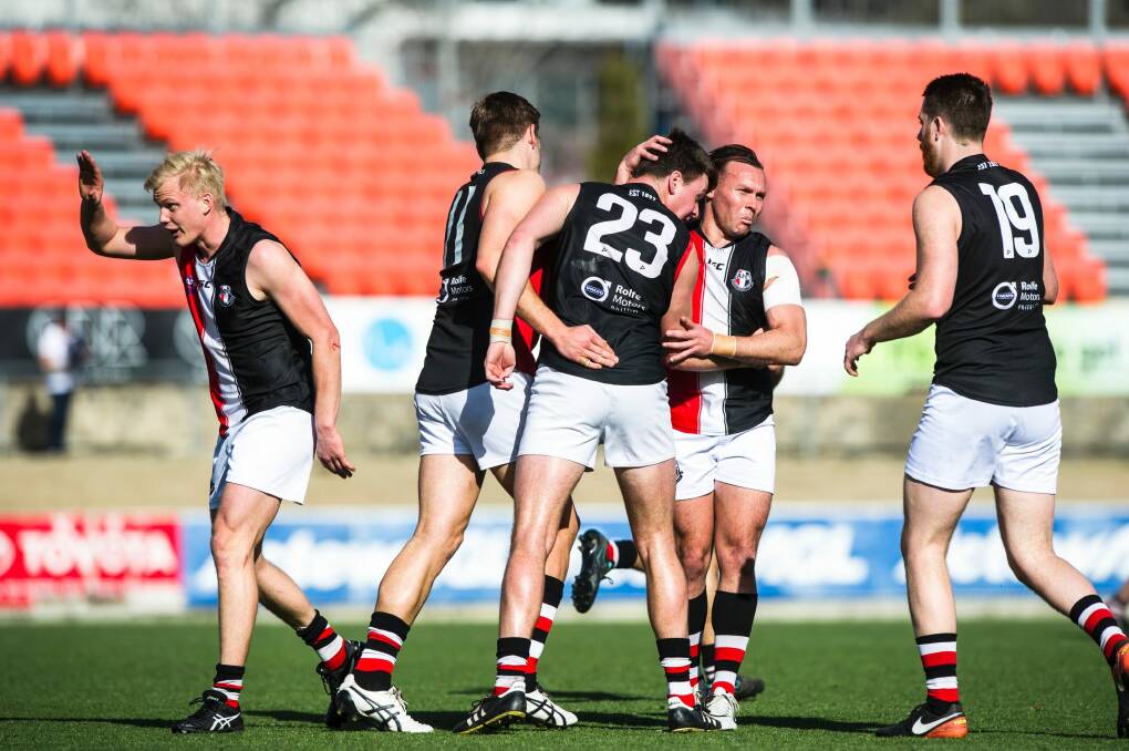 Ainslie players celebrate a goal in their grand final win over Queanbeyan. Photo: Jamila Toderas
