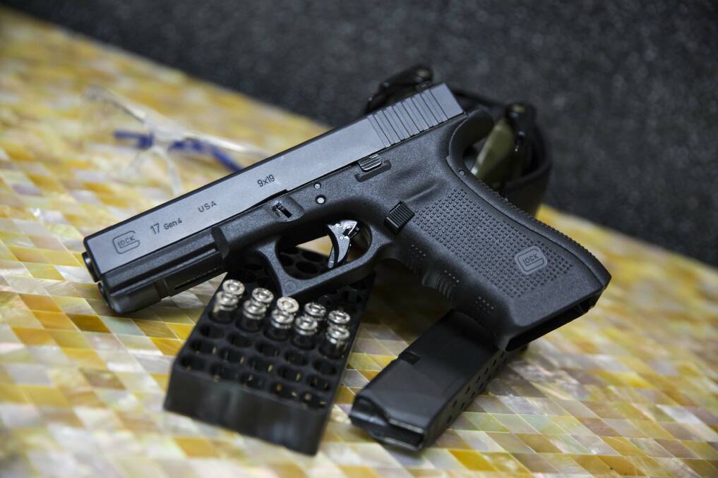 A police-issued Glock has gone missing from an Ipswich police station. Photo: Taylor Weidman/ Bloomberg