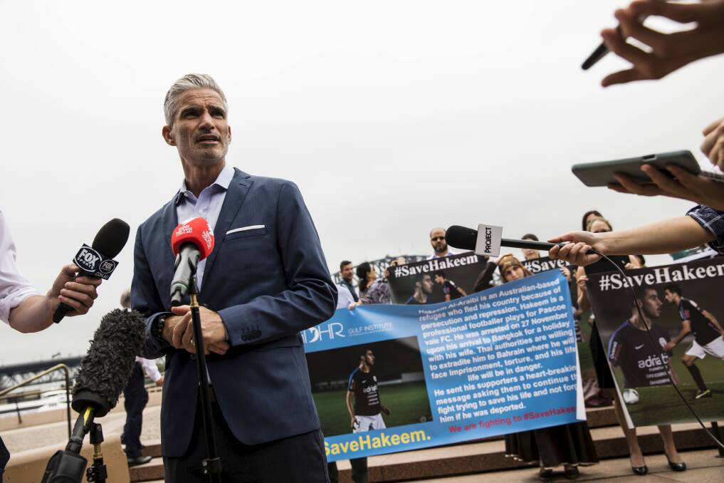 Former Socceroos star Craig Foster with demonstrators urging Thailand to release Hakeem al-Araibi, a Melbourne refugee and football player. Photo: Dominic Lorrimer
