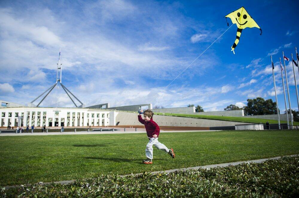 Charlie Lansdown-McCulloch, 5, of Warramanga, marks Global Wind Energy Day outside Parliament House. Photo: Rohan Thomson