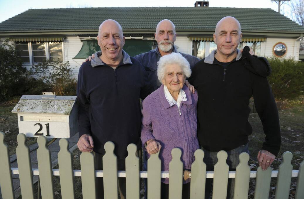 The French triplets - Tom, Mick and Bob - at the family home in Narrabundah with mum Elaine. Photo: Graham Tidy