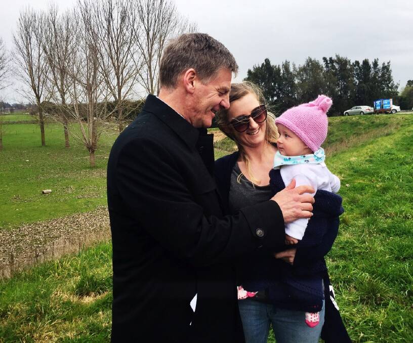Prime Minister Bill English gets introduced to a Hawke's Bay early childhood teacher and her baby while on the campaign trail. Photo: Jo Moir