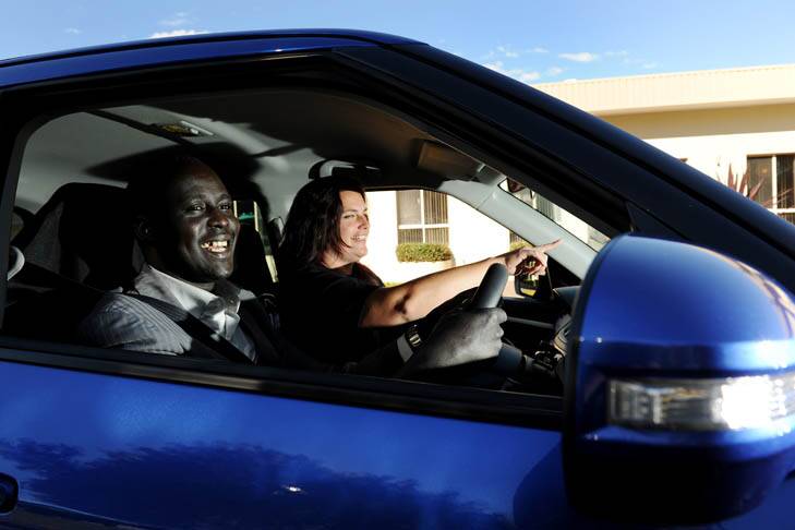 Road to success ... Samuel Anyang learns to drive with instructor Nicole Warren. Once qualified, Mr Anyang will train Sudanese people. Photo: Colleen Petch