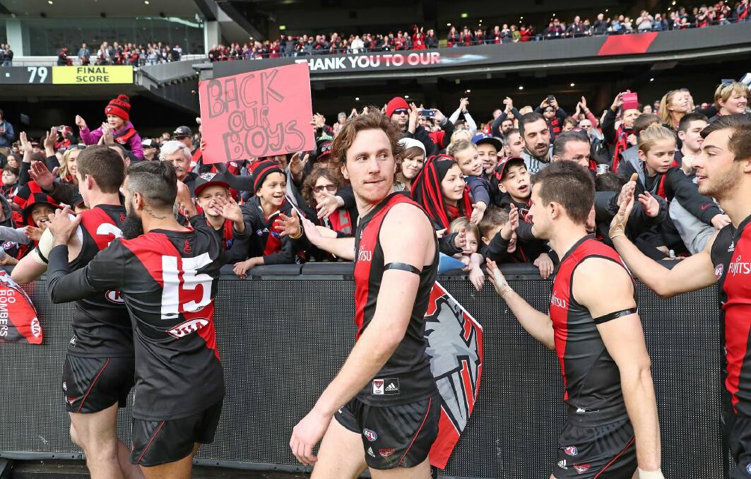 The Bombers thank their supporters in the crowd and the 2016 recruits. Photo: Getty Images