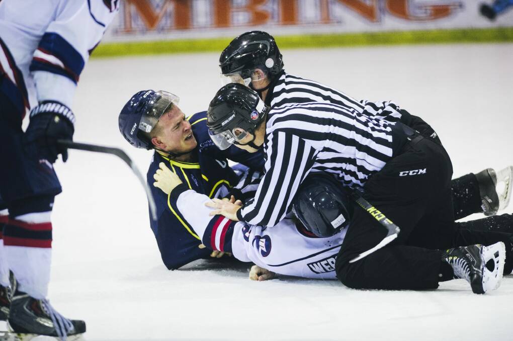 Two referees break up a fight between Brave's Jordan Gavin and Ice's Lliam Webster. Photo: Rohan Thomson
