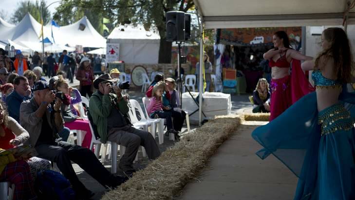 Photographers taking photos of the Isistars Belly Dancers at the Canberra Folk Festival on Good Friday. Photo: Jay Cronan