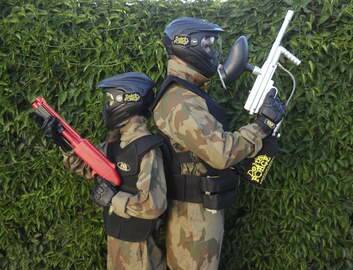 A child with a miniball gun versus an adult with a paintball gun. <i> Photo: Delta Force Paintball. </i>