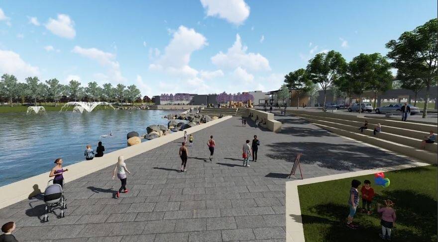 The first glimpse of the development shows a man-made lake with boardwalk, cafes, shops and community services. Photo: Sherryn Groch
