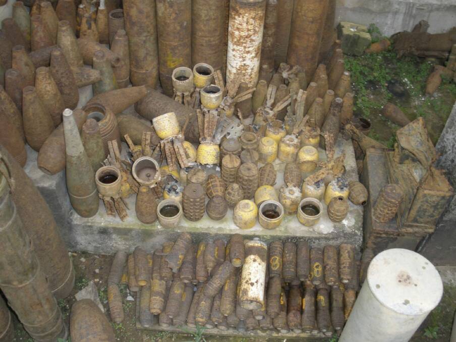The devil's harvest: This large collection of unexploded ordinance, ranging from aerial bombs to artillery and mortar shells and hand grenades, were collected by disposal teams from the Mines Advisory Group in Laos. The yellow weapons are cluster bomblets.