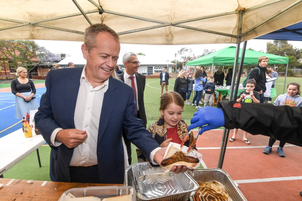 Onion but no sauce. Bill Shorten strikes again at the sausage stall.  Photo: AAP