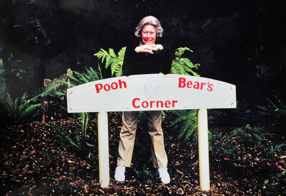  Barbara Carter with the early sign installed by Eurobodalla Council at Pooh Bear's Corner. Photo: Supplied