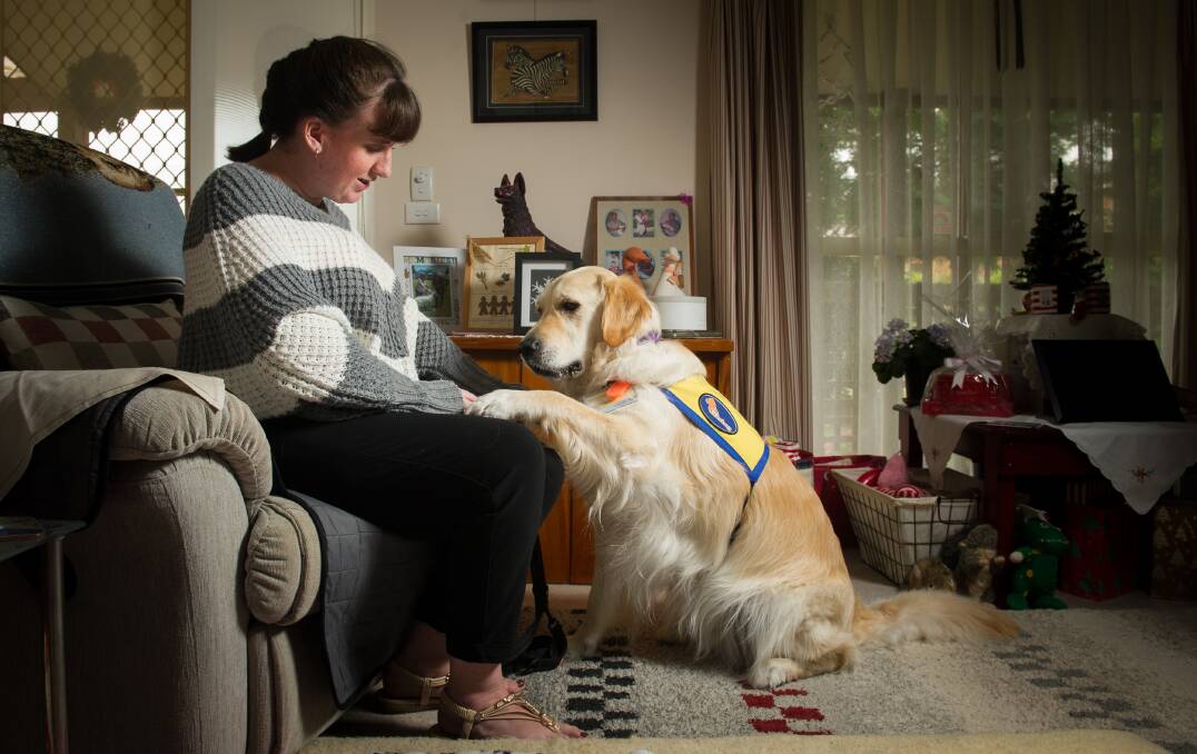 Shirley McMahon with her assistance dog 'Coopa' who is trained to recognise seizures and is also there to help with depression. Photo: Elesa Kurtz