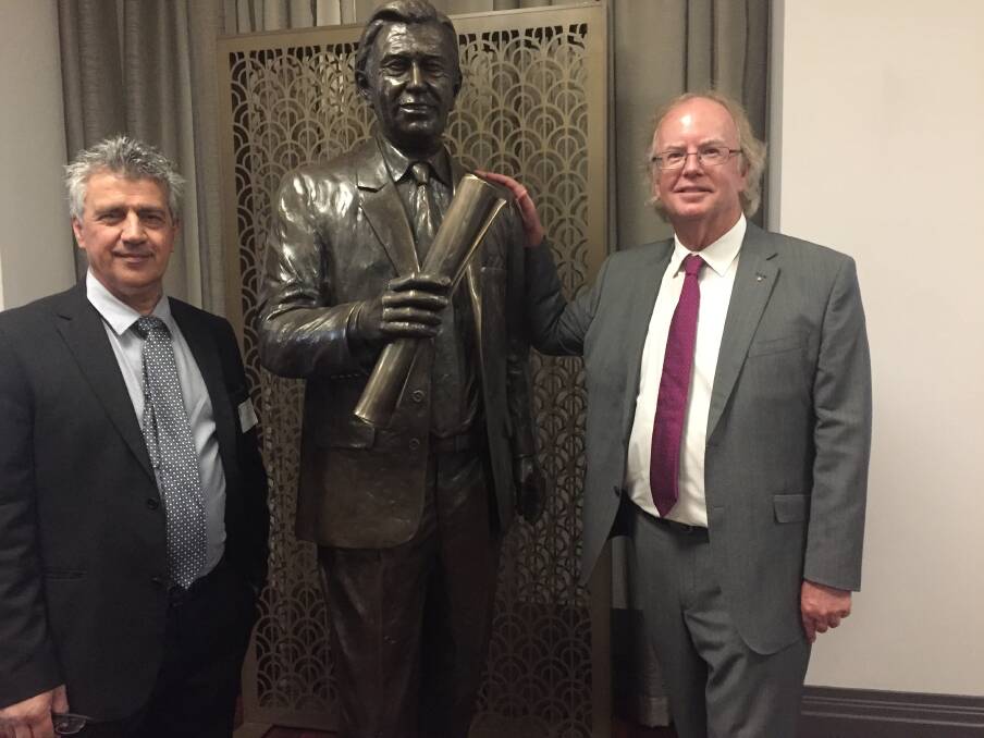 Bronze statue of former lord mayor Clem Jones with sculptor Phil Piperides and Clem Jones Trust chairman David Muir.  Photo: Tony Moore