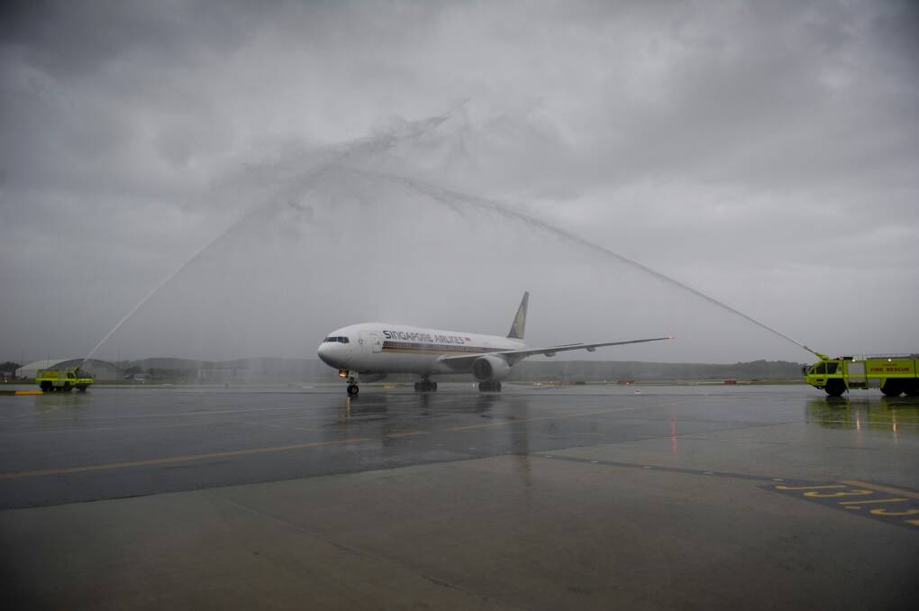 Water cannon greeted the first Singapore Airlines flight. Photo: Jay Cronan