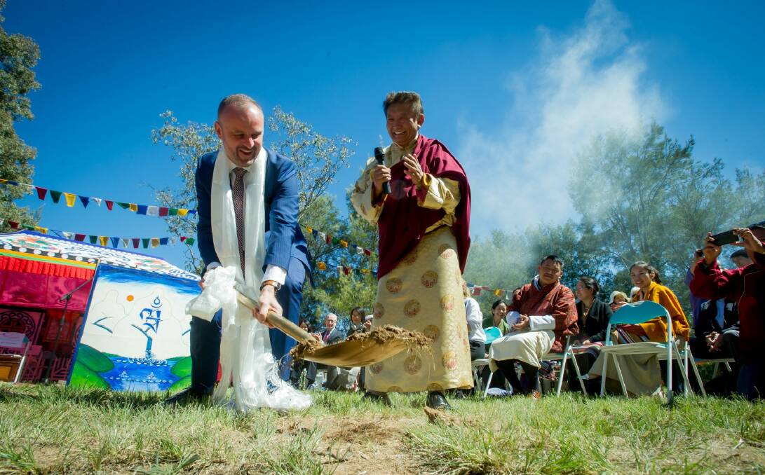 Chief Minister Andrew Barr and the spiritual leader Lama Choedak Rinpoche turn the first sod at the Stupa Temple of Peace, at Jenke Circut, Kambah.  Photo: Karleen Minney
