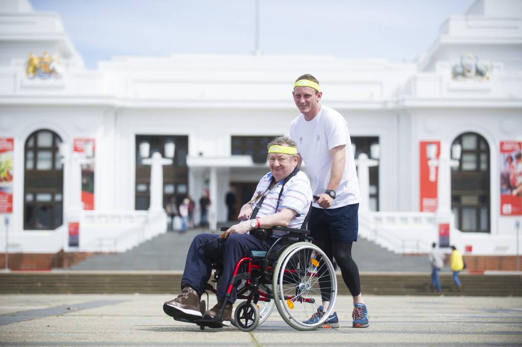 Isaac Marshall will be running the 5km Canberra Times Fun Run with his uncle Ronald Marshall who uses a wheelchair after having a stroke. Photo: Dion Georgopoulos