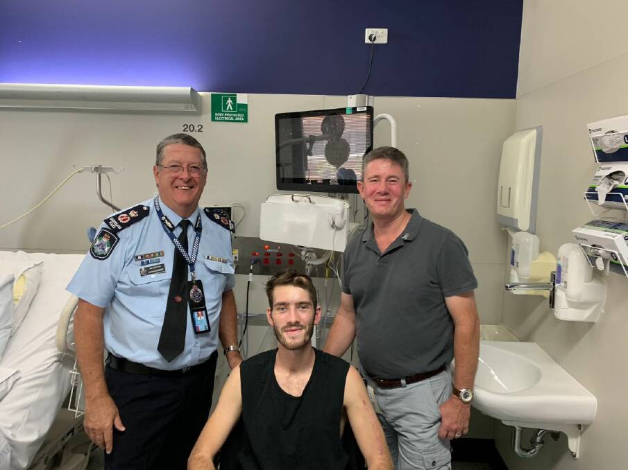 Queensland Police Constable Peter McAulay in hospital with his father Mike and Police Commissioner Ian Stewart. Photo: Commissioner Stewart