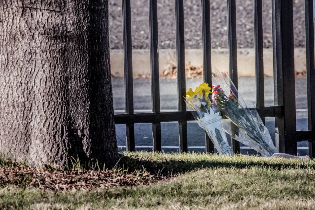 Flowers left at the scene by a family with two young children on Friday morning. Photo: Karleen Minney