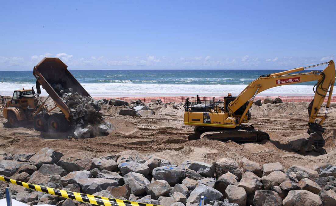Cyclone preparations in full swing on the Gold Coast, with the construction of a sea wall to try to reduce erosion. Photo: Dave Hunt - AAP