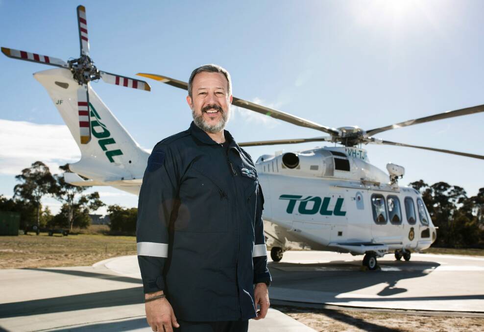 Gerard Longley in front of the new Agusta Westland 139 helicopter. Photo: Jamila Toderas