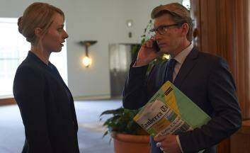 Heart of power: Media adviser Sophie Walsh (Chelsie Preston Crayford) with Deputy Prime Minister Ian Bradley (David Wenham), who is clearly a Canberra Times reader. Photo: Supplied