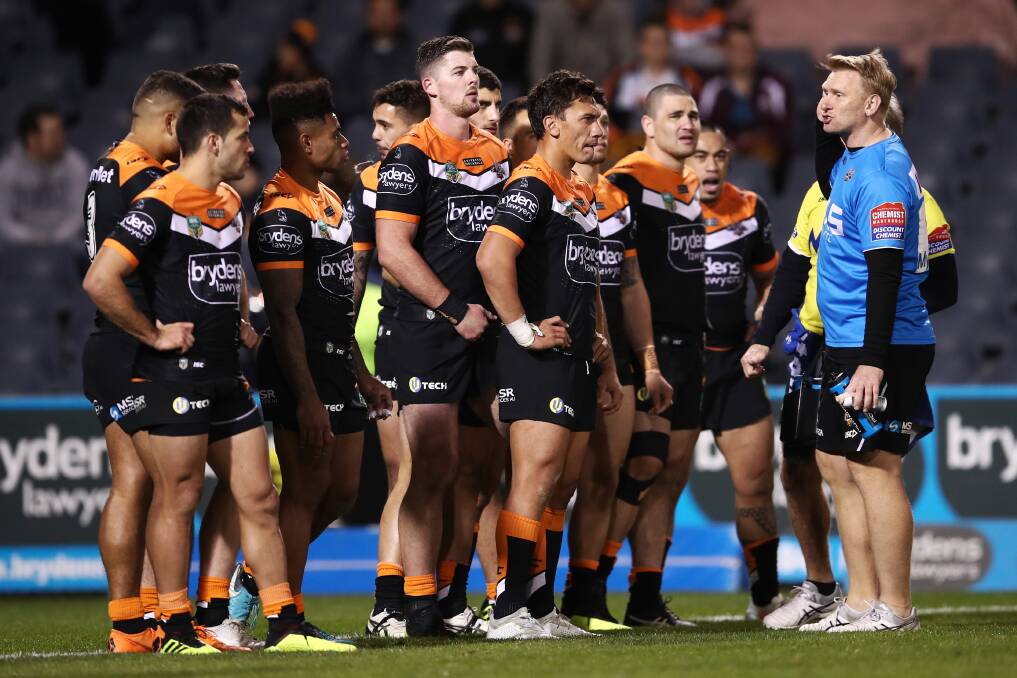 Regroup: The Tigers await another Raiders conversion on a day they'd prefer to forget. Photo: AAP