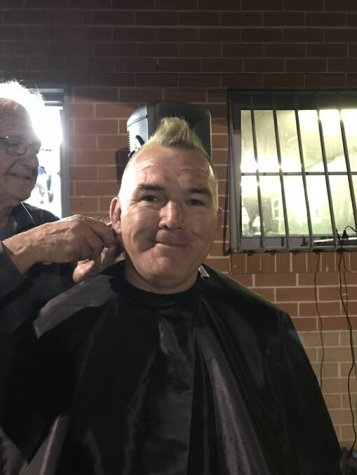 Owen Finegan getting his head shaved. Photo: Supplied
