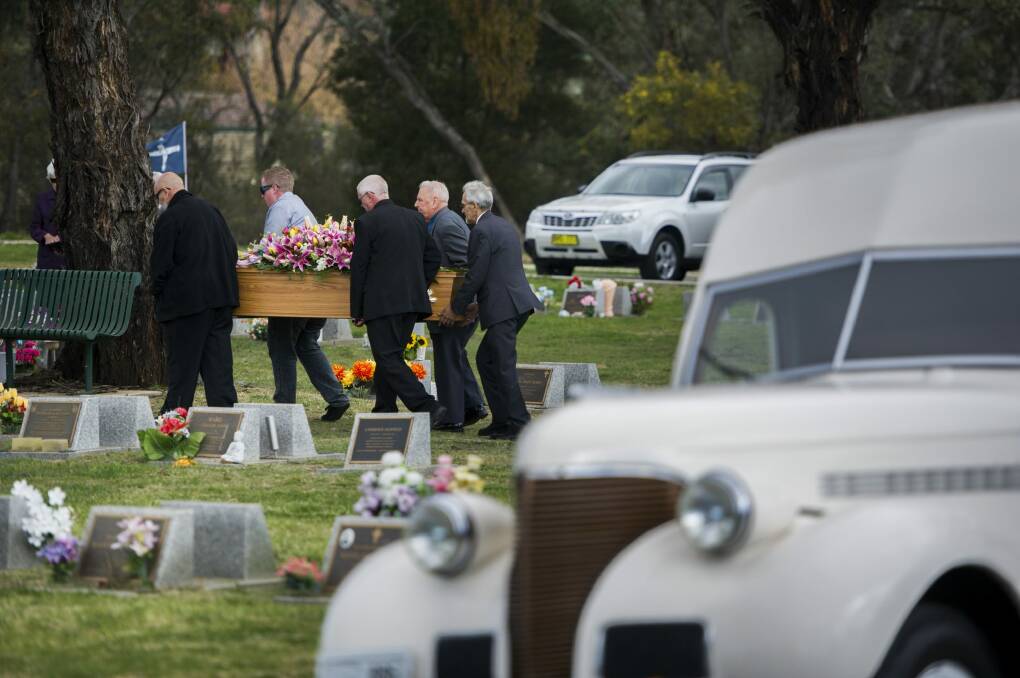 The funeral procession arrives at Queanbeyan Lawn Cemetery led by the restored pie truck that Leicester Donoghoe used to drive.  Photo: Rohan Thomson