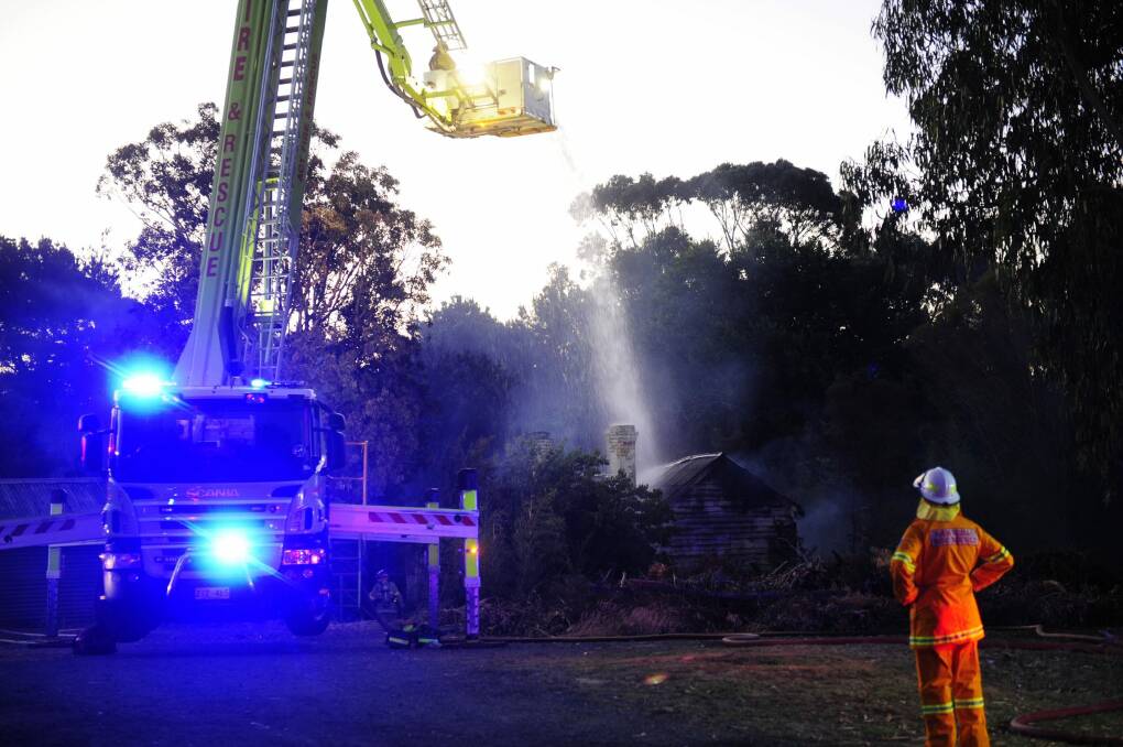 ACT and NSW Fire and Rescue at the scene of a fire at Cantle's Cottage in Queanbeyan. Photo: Melissa Adams