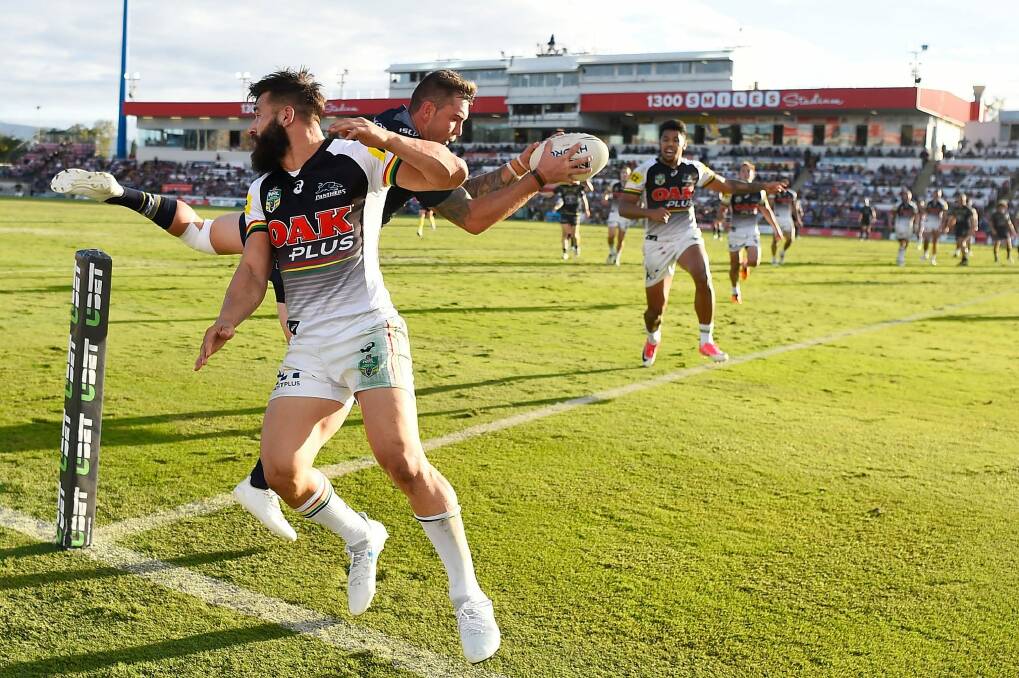 Acrobatics: Kyle Feldt of the Cowboys catches a high ball to score a try against Penrith at 1300SMILES Stadium on Saturday. Photo: Ian Hitchcock