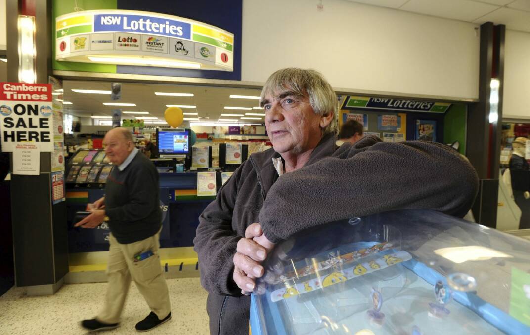 Garry Prince, owner of the NewsXpress newsagency and lotto outlet at Kippax Fair shopping centre, Holt. He is concerned that Woolworths petrol outlets will soon be able to sell lotto tickets and scratchies. Photo: Graham Tidy. 