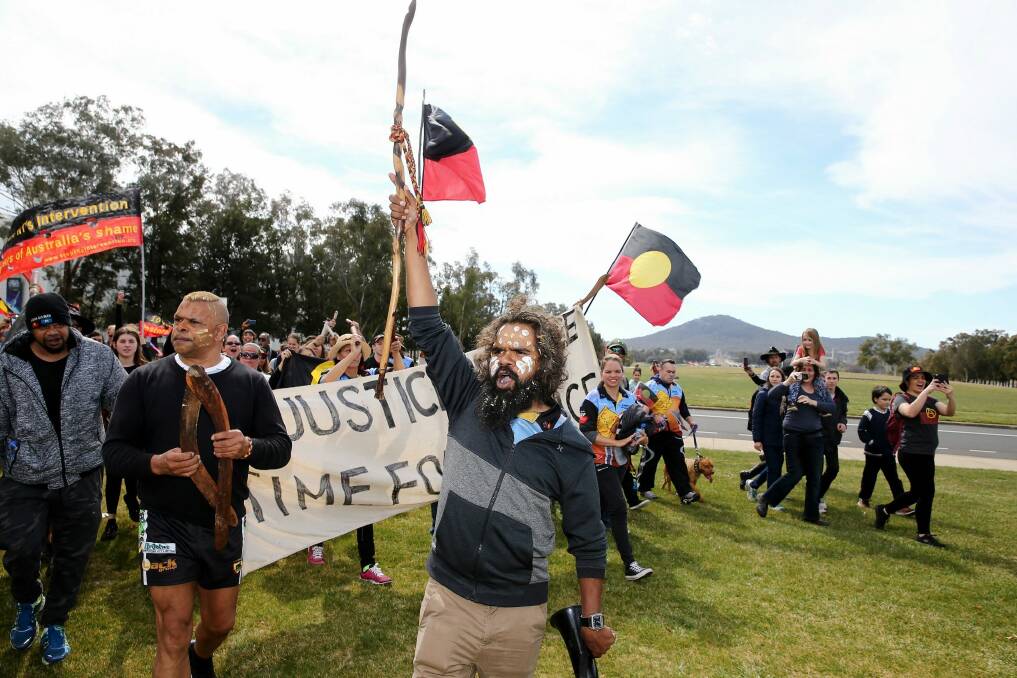 Clinton Pryor  approaches the Aboriginal Tent Embassy and the end of his walk. Photo: Alex Ellinghausen