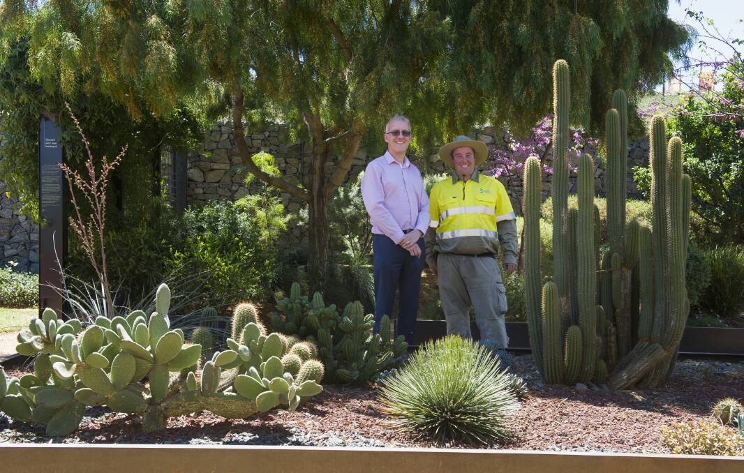Dr Matt Parker and Ryan Mallard in the discovery garden which features many drought resistant plants suitable for the Canberra climate. Photo: Elesa Kurtz