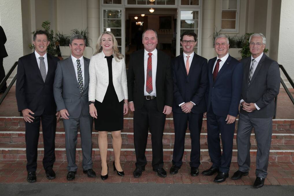 Nationals MPs in the ministry pose with leader Barnaby Joyce (centre) after Wednesday's swearing-in ceremony at Government House. Photo: Alex Ellinghausen