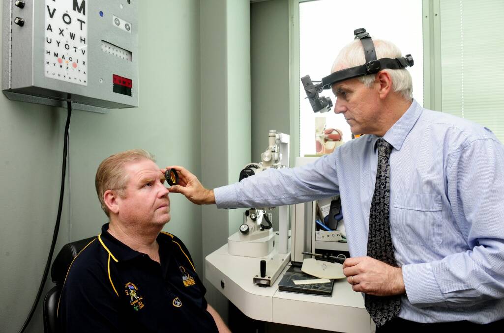 Mr Murray has his eyes checked by optometrist Dr Mark Feltham. Photo: Melissa Adams